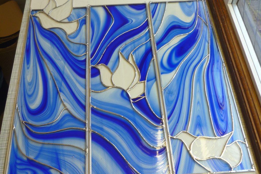 Beautiful set of three copper foiled panels made by a student on our stained glass course.