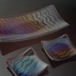 This fused glass platter and small glass dishes are an example of what you can make using glass fusing techniques.