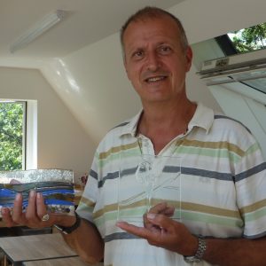 A happy customer collects his creations after his glass fusion class in Kent, near Ashfords