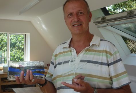 A happy customer collects his creations after his glass fusion class in Kent, near Ashfords