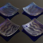 Set of 4 fused galss Strata dishes in royal blue transparent glass. Photo © M.Wilson