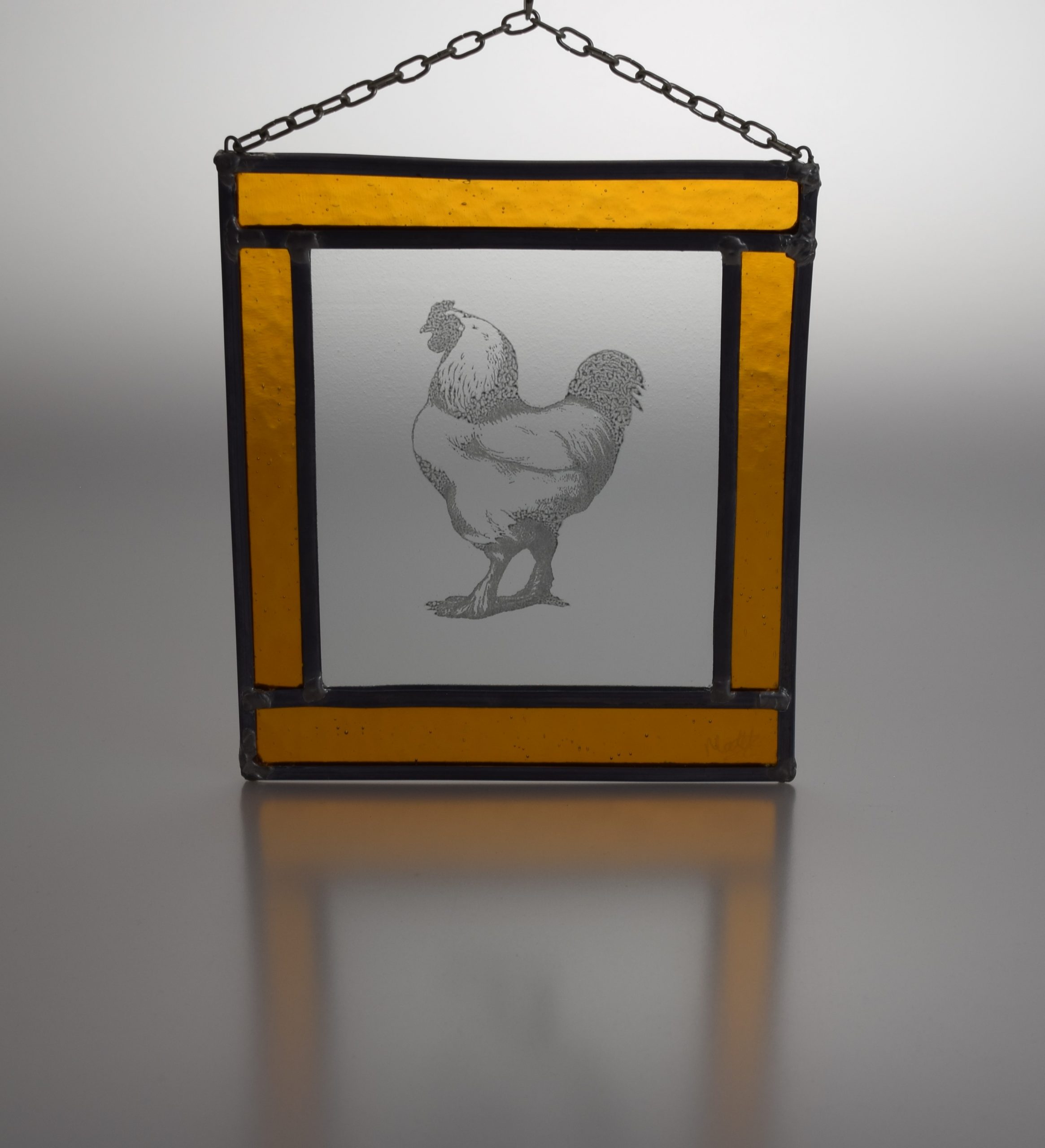 Majestic cockerel stained glass picture in egg yolk yellow frame