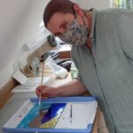 Following on from a first day of glass fusing, an improver student makes a lovely glass picture of Durdle Door in Dorset